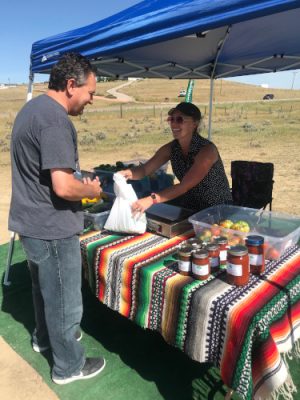 Selling produce and jars at the Trail Creek Gardens stand